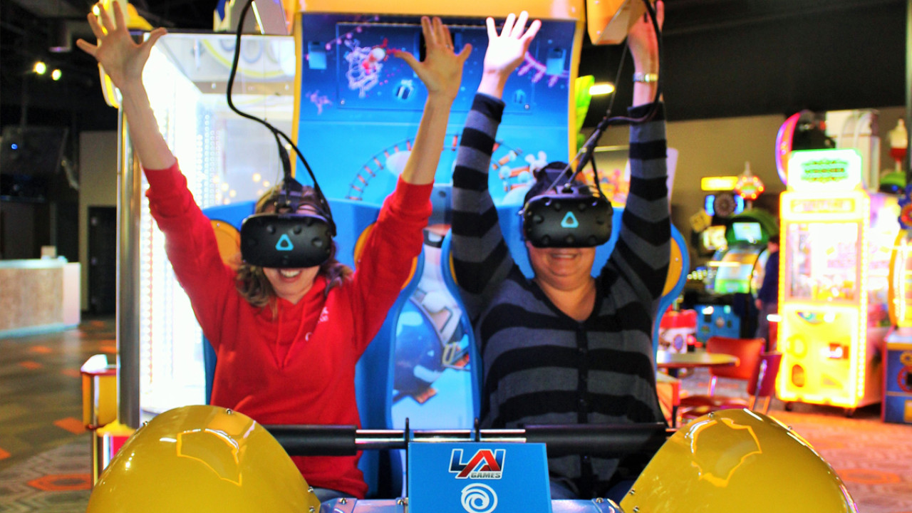 Adults enjoying VR game